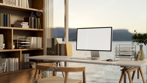 Preview: White screen computer on wooden table and chair aside bookshelf in glass wall bedroom or living room