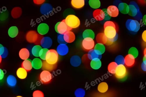 Preview: Blurred festive colorful lights over black useful as background