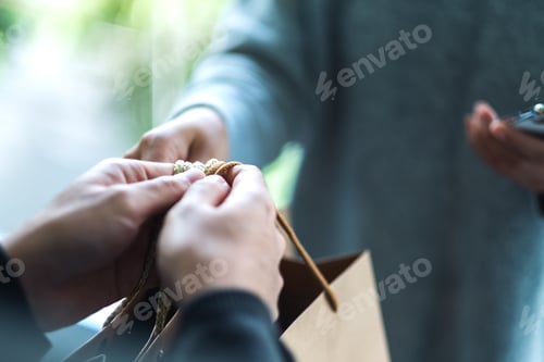 Preview: A woman receive shopping bags form delivery man