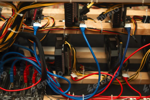 Preview: Close-up of network connection plug in data center. Network server background. Blue and red compute