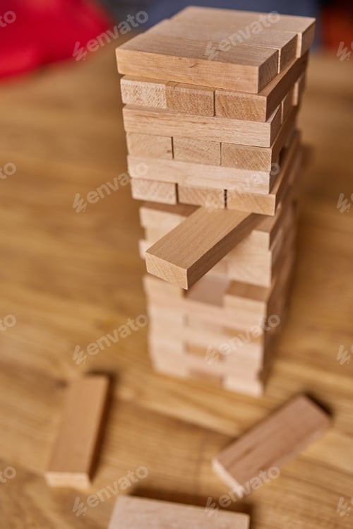 Preview: Tower of wood blocks stack game on the table