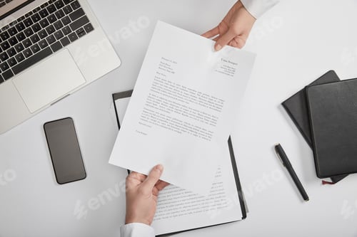 Preview: top view of clerks holding contract at workplace with copy space