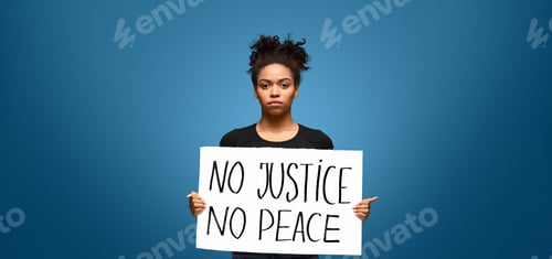 Preview: African american girl holding placard No Justice No Peace
