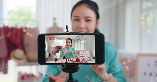 Preview: Asia woman micro influencer record live viral video camera at home studio.