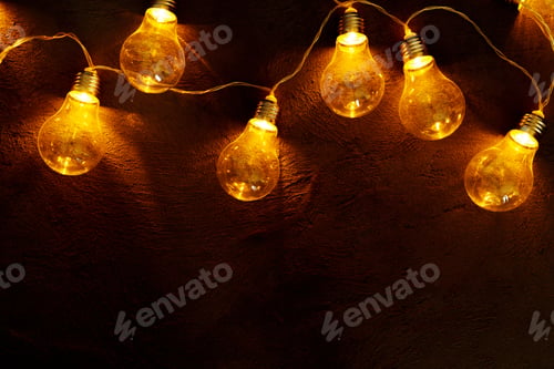 Preview: Garland of light bulb lamps in the dark