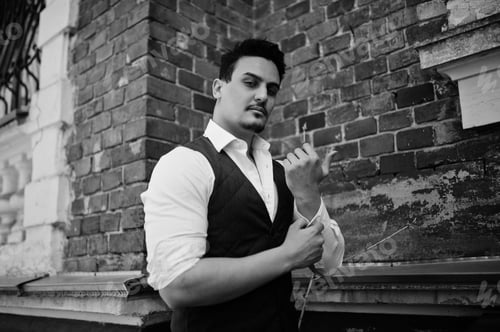 Preview: Portrait of retro 1920s english arabian business man wearing waistcoat.