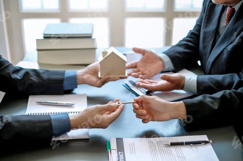 Preview: Real estate agent giving keys to customer. Trading house for rent and insurance concept.