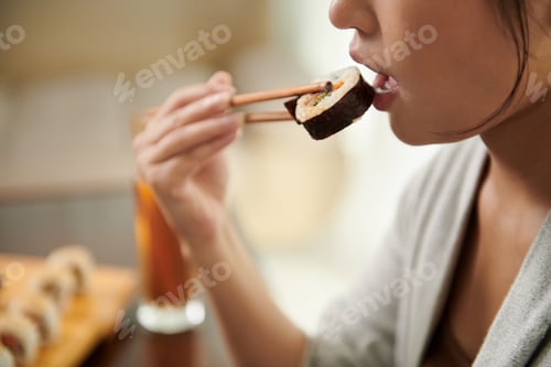 Preview: Woman Eating Delicious Sushi