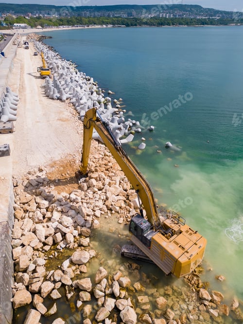 Preview: An excavator diligently constructs a dock or breakwater in the sea, its mighty arm reaching out from