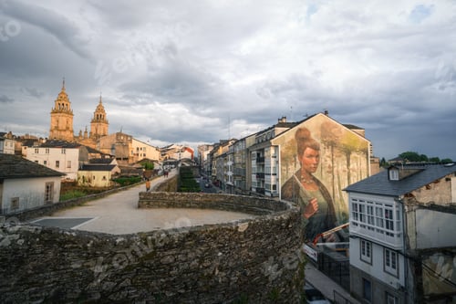 Preview: The mural of the ancient Celtic warrior Copora by Yoe33 next to the Roman wall in Lugo