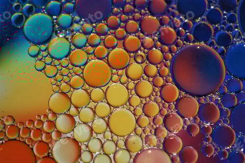 Preview: Vibrant background of colorful oil and water bubbles forms against a vivid colorful backdrop
