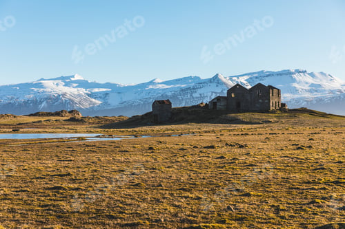 Preview: Iceland bleak landscape, ruined house and mountains