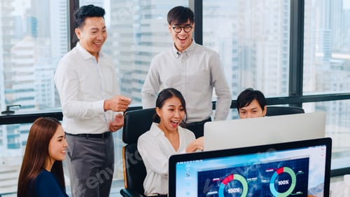 Preview: Millennial group of young Asia businessman and businesswoman celebrate feeling happy in office.