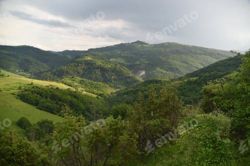 Preview: Panoramic view of mountains and hills in spring time