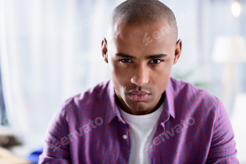 Preview: serious african american man looking at camera