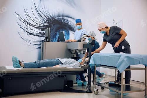 Preview: Team of ophthalmologists performing laser eye surgery at the clinic.