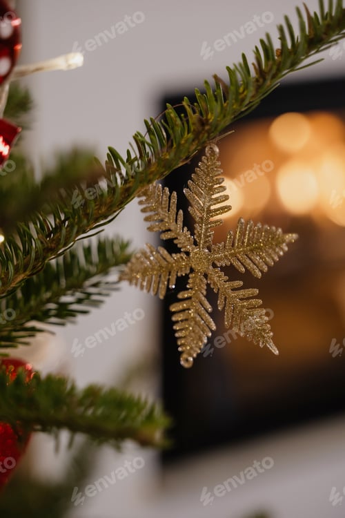 Preview: Close-Up of Christmas Tree Ornaments with Fireplace in Cozy Living Room
