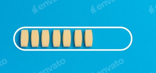 Visualização: Comprimidos ovais amarelos em um fundo azul, vista superior
