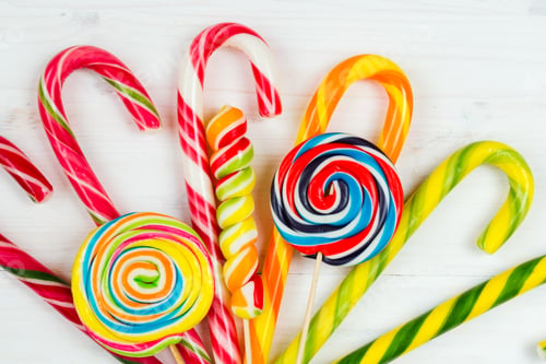 Preview: Colorful candy on the wooden background