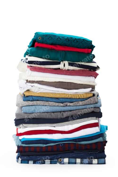 Preview: Stack of clothes on white background, closeup