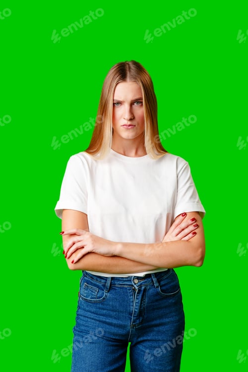Preview: Young Woman With Pursed Lips Expressing Skepticism Against Green Screen Background