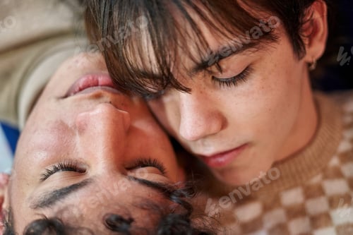 Preview: Passionate sexual gay couple in an intimate moment lying on the sofa at home