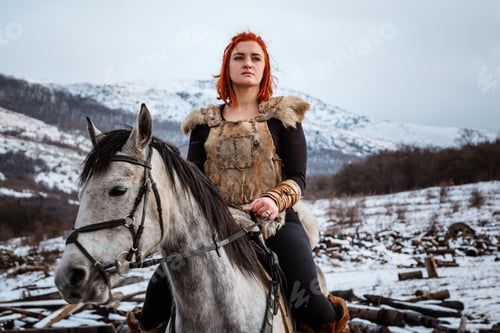 Preview: Beautiful girl on horse and with red hair in armor. Woman is a Viking. Fantasy