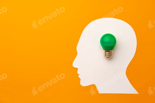 Preview: Papercut head and light bulb on paper background
