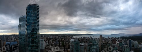 Preview: Aerial view of Downtown City during a stormy summer sunset