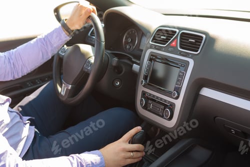 Preview: Man driving a car