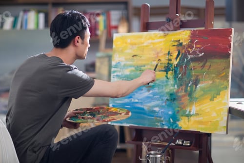 Preview: Artist painting in his studio