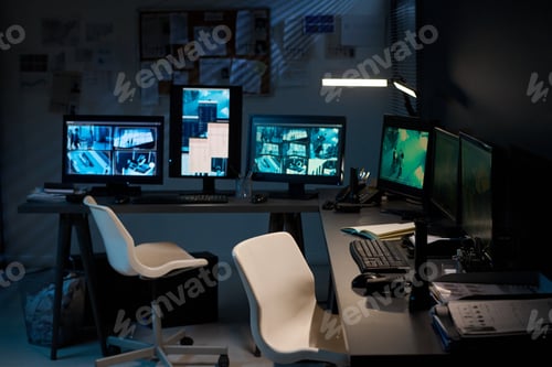 Preview: Dark Monitoring Room Filled with Surveillance Equipment