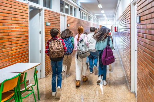 Preview: Group of students running in school hallway between classes