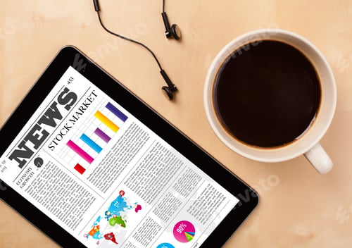 Preview: Workplace With Tablet Pc Showing Latest News And A Cup Of Coffee On A Wooden Work Table Close-Up