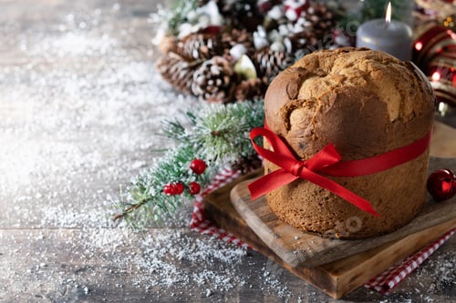 Preview: Traditional Christmas panettone and Christmas ornament on wooden table