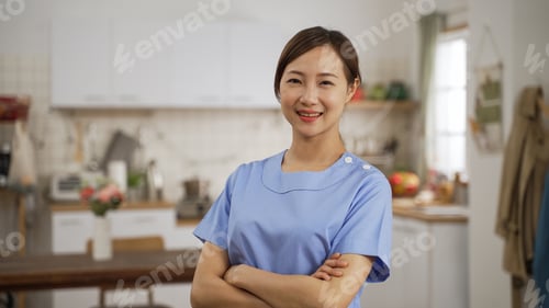 Preview: female nursing aide looking at camera