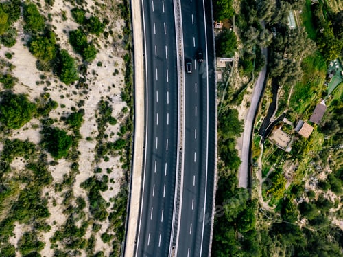 Preview: Aerial view of summer landscape with road. Highway with cars in rural Italy.