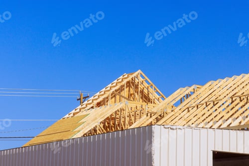 Preview: Frame installation of wooden roofing trusses to a house under construction