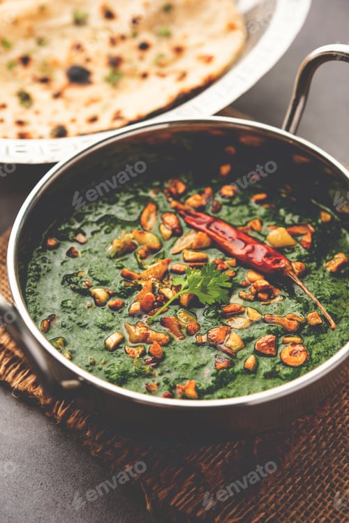Preview: lasooni palak recipe or dhaba style garlic spinach curry, Indian main course served with naan