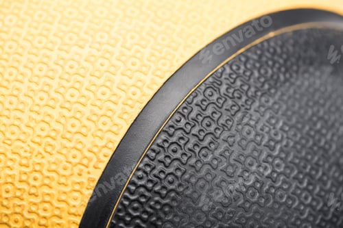 Preview: Extreme closeup of a black and yellow sports ball texture