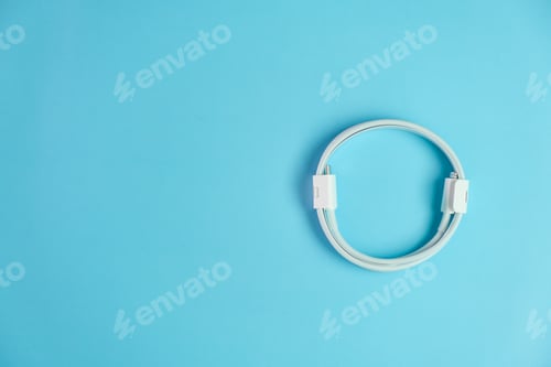 Preview: Cable with usb type C and lightening on the blue background with copy space