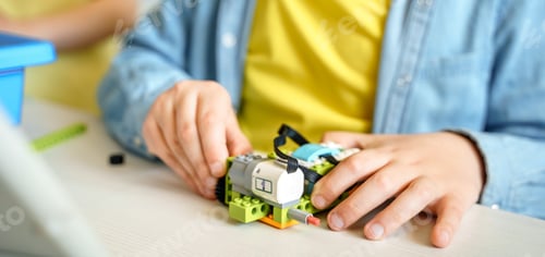 Preview: Programming work for robotics in elementary school. Children girls students assembly, launch, coding