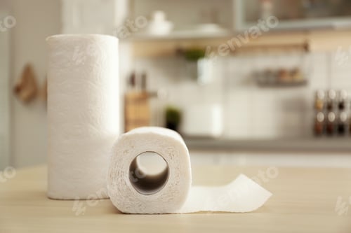 Preview: Rolls of paper towels on table in kitchen. Space for text