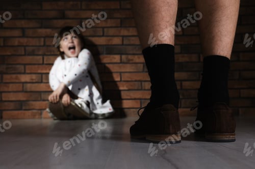 Preview: Adult man without pants standing in front of scared little girl indoors. Child in danger