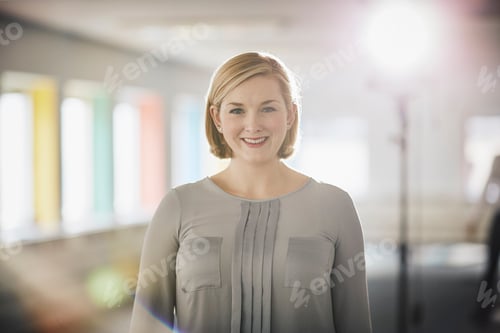 Preview: Professional Woman Smiling in Bright Modern Office