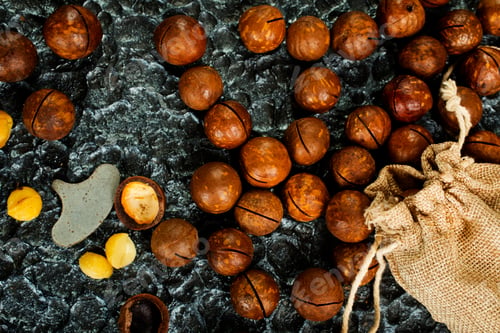 Preview: Organic Macadamia nut on wooden table, helthy food