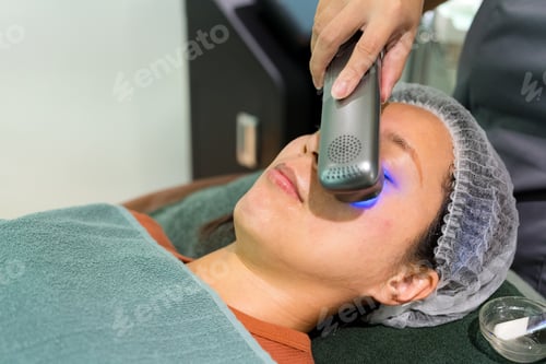 Preview: Woman enjoy the facial treatment at beauty salon