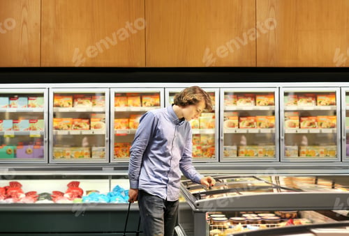 Preview: Man Choosing Frozen Food From A Supermarket Freezer