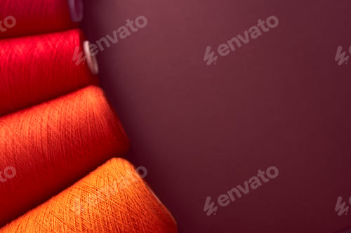 Preview: Composition of colorful vibrant wool threads from above. Autumn colours