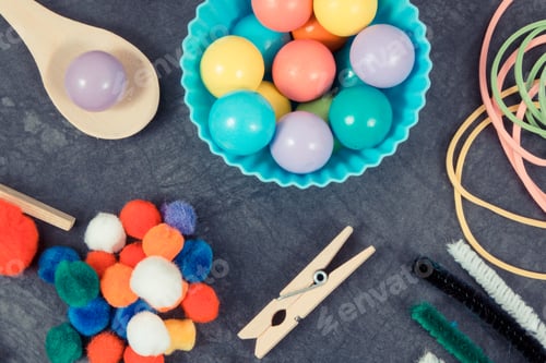 Preview: Colorful pompoms, balls and erasers using for development of kids motor skills